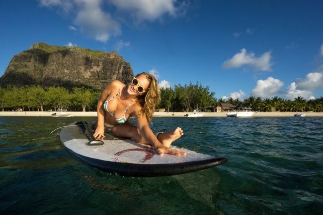 Woman doing yoga on a Stand Up Paddleboard