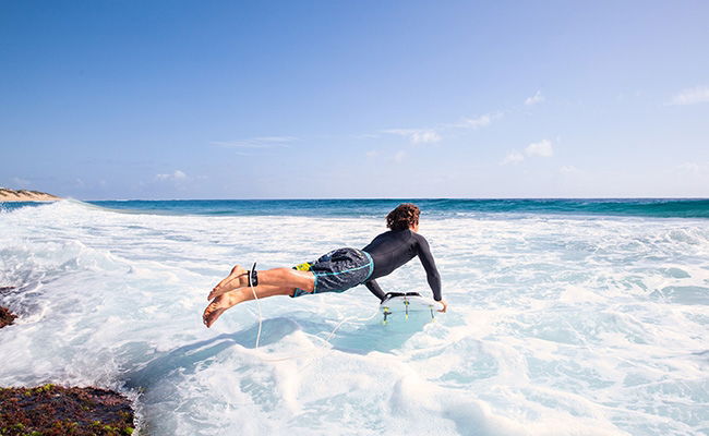 surfer in rash vest