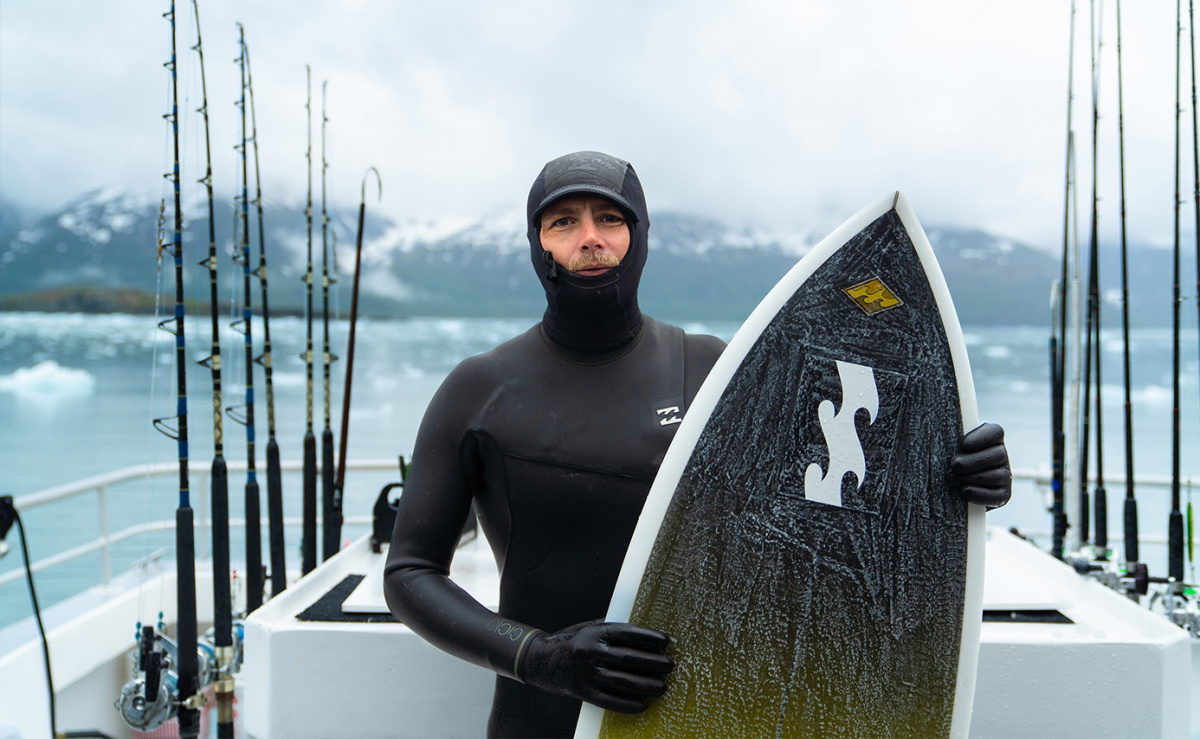 Surfer wearing a Billabong wetsuit made from recycled jerseys, liners and foam
