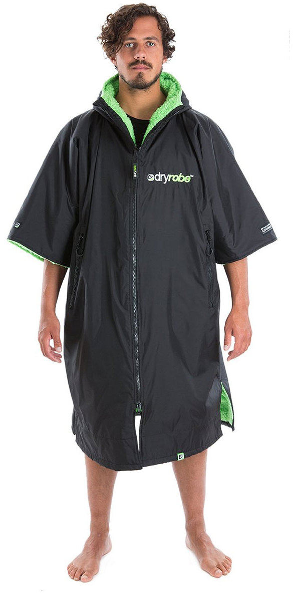 Man wearing a black short-sleeved dryrobe change robe with bright green lining, studio shot on white
